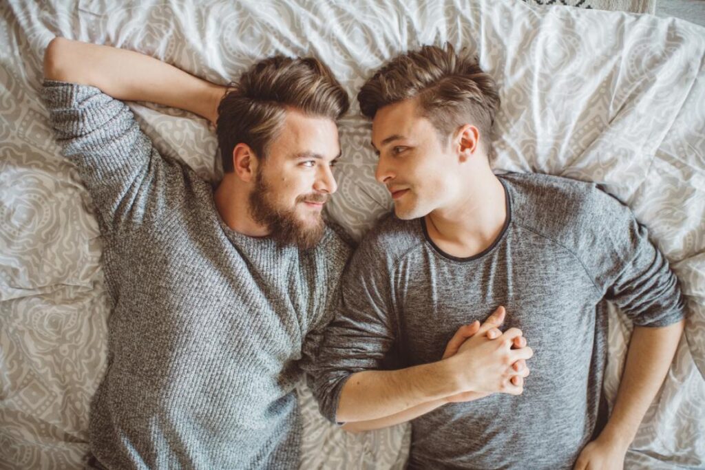 Drugs Treatment Stop HIV Transmission in Gay Couples 5 gay male couple holding hands in bed