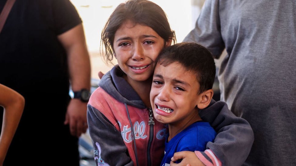 Palestinians wounded in Israeli bombardment of the Gaza Strip are brought to a hospital in Khan Younis